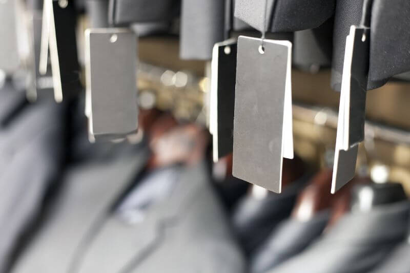 Label tags hanging from clothes