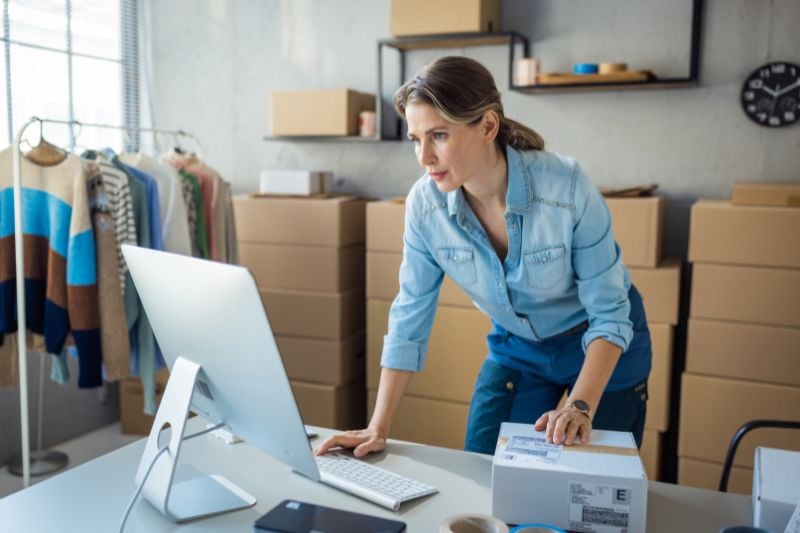 Woman working in retail store.