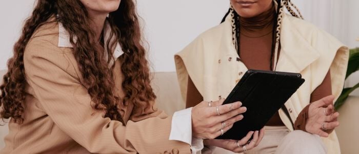 fashion business leaders reviewing work